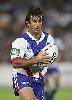 Andrew Johns makes a run ...