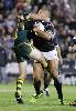 Paul Rauhihi smashes past Danny Buderus.