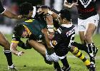Danny Buderus is crunched by Ruben Wiki and Nigel Vagana.