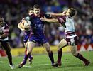 Matthew Gidley puts on a big fend.