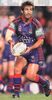Andrew Johns throws a pass.