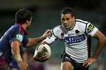 Justin Hodges puts the moves on Brian Carney.
