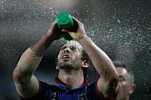 Andrew Johns takes a drink and tries to imagine he is elsewhere.