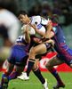 Karmichael Hunt is tackled.