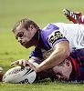 Matthew Gidley stretches out to score.