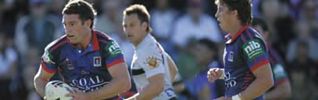 Danny Buderus darts out of dummy half, with Kurt Gidley in support.
