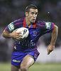 Andrew Johns makes a run.