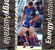 Andrew Johns limping with an ankle injury.