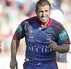 Andrew Johns struggles with his ankle injury.