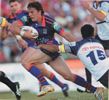 Kurt Gidley rockets past David Faiumu.