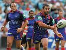 Andrew Johns shifts the ball to wider support.