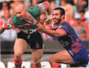 Old chums Adam MacDougall and Andrew Johns enjoy their clash.