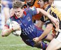 Matthew Gidley is taken to the turf.