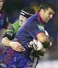 Hat-trick hero Brian Carney is tackled ...