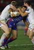Brian Carney is crunched by stellar St George Illawarra defence.