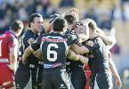 The Warriors celebrate one of Nathan Fien's two tries.