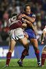 Craig Smith batters the Manly line.