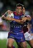 Andrew Johns takes a hit-up.