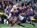Danny Buderus is taken to the ground.