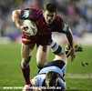 Matthew Gidley strides clear of a tackle.