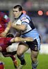 Paul Gallen almost gets away from a Knight.
