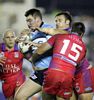 Luke Douglas is grabbed by Josh Perry and Adam Woolnough.
