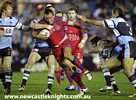 Craig Smith bullocks the ball forward.
