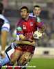 Andrew Johns gets an offload away.