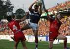 Amos Roberts takes a bomb in defence.