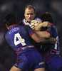Steven Bell can't find a way through strong Newcastle defence.