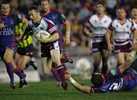 ... skipping clear of the inneffectual tackle ...