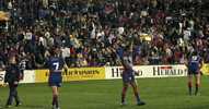 Andrew Johns goes looking for the tee, to convert his opening try.