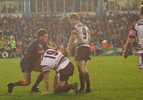 Danny Buderus works George Rose over in the play the ball.