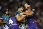 Trent Waterhouse can't breach the solid Newcastle defence.