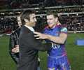 Andrew Johns congratulates Matthew Gidley on a terrific farewell match.