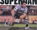 Danny Buderus passes from dummy-half.