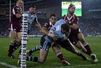 Steve Simpson watches as Matt King is bundled into touch, early in the match.