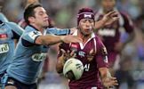 Danny Buderus can't prevent Johnathan Thurston from passing.