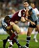 Nathan Hindmarsh and Danny Buderus tackle Brent Tate.