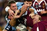 Brett Kimmorley and Steve Simpson tackle Shaun Berrigan.