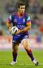 Andrew Johns prepares to do something ...