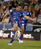 Andrew Johns boots the ball downfield.