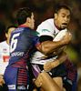 Antonio Kaufusi is grabbed by Jarrod Mullen.