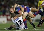 Matthew White about to land on Brad Thorn.