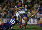 Brett Kearney has Adam Woolnough down low and Michael Young up top.