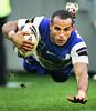 Hazem El Masri dives over for a try.
