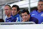 Andrew Johns and the injured Jarrod Mullen look on ...