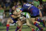 Brad Cross is thumped by Jarrod Mullen and Chris Bailey.