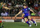 Jarrod Mullen boots the ball downfield.
