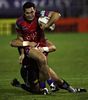Back in his hometown, George Carmont is tackled.